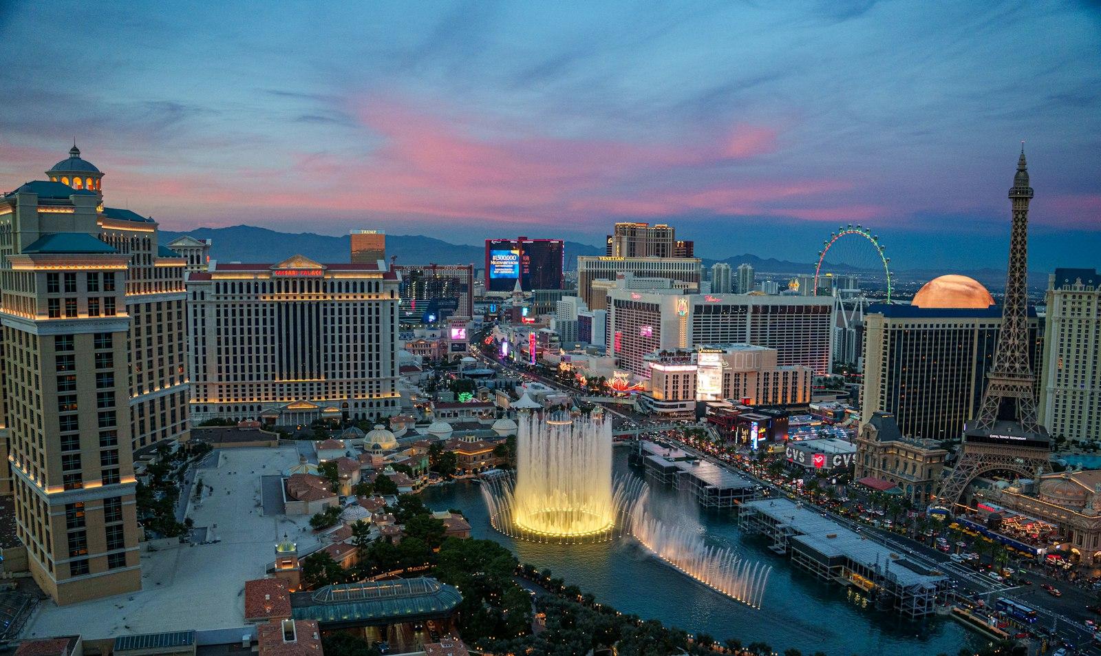 Las Vegas skyline at dusk with mountains in the background